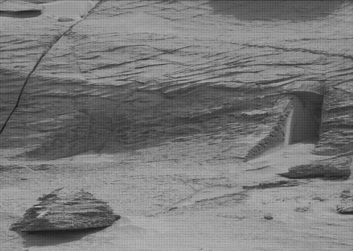 mysterious hole alien doorway on Mars